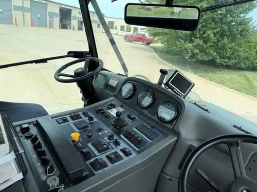 Operator control panel and dashboard inside a 2018 Elgin Pelican NP street sweeper.